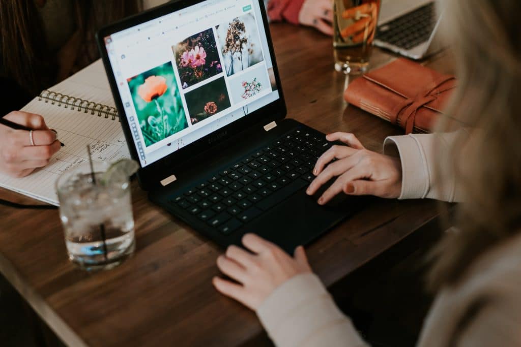 a woman looking at her laptop